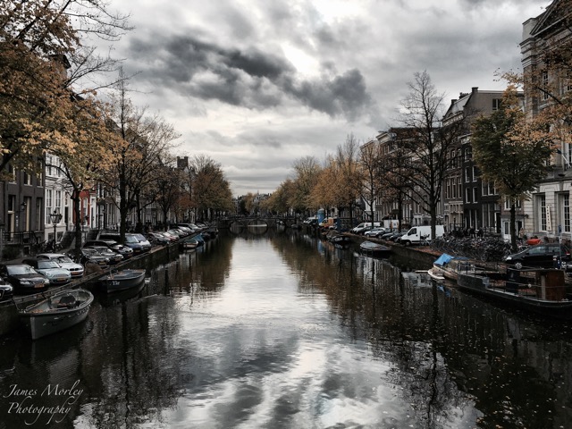 Amsterdam cloudy sky canal.jpg