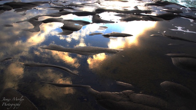 Sunset reflection in sea puddles.jpg